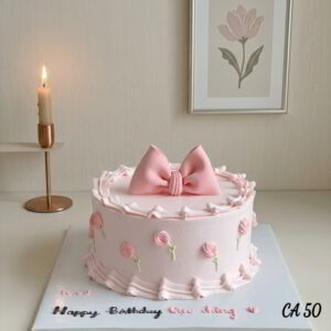 Round cake with flowers decorations and a fondant bow CA50